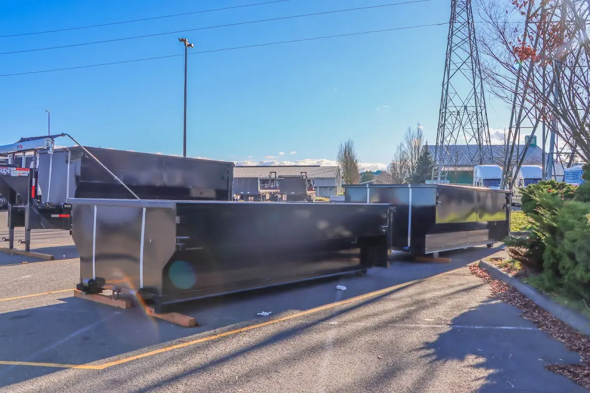 Roll-off dumpster ready for waste disposal at job site for Demolition Dumpster Rental in Westwood